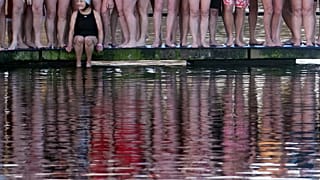 Swimmers prepare to take part in the annual Christmas Day Peter Pan Cup handicap race in the Serpentine River, in Hyde Park, London, Britain. 25 December, 2019.