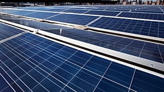 A rooftop is covered with solar panels at the Brooklyn Navy Yard, Tuesday, Feb. 14, 2017, in New York