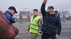 A pro-Russian prisoner celebrates during an exchange close to the Maiorske checkpoint, Donetsk.