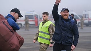 A pro-Russian prisoner celebrates during an exchange close to the Maiorske checkpoint, Donetsk.