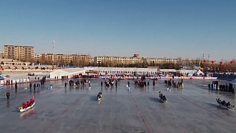 Some 600 athletes participate in ice dragon boat race 