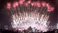 In this Sunday, Jan. 1, 2017 photo, fireworks explode over the Sydney Opera House and Harbour Bridge as New Year's celebrations are underway in Sydne. (AP Photo/Rick Rycroft, 