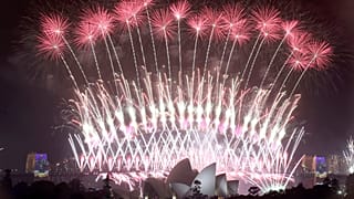 In this Sunday, Jan. 1, 2017 photo, fireworks explode over the Sydney Opera House and Harbour Bridge as New Year's celebrations are underway in Sydne. (AP Photo/Rick Rycroft, 