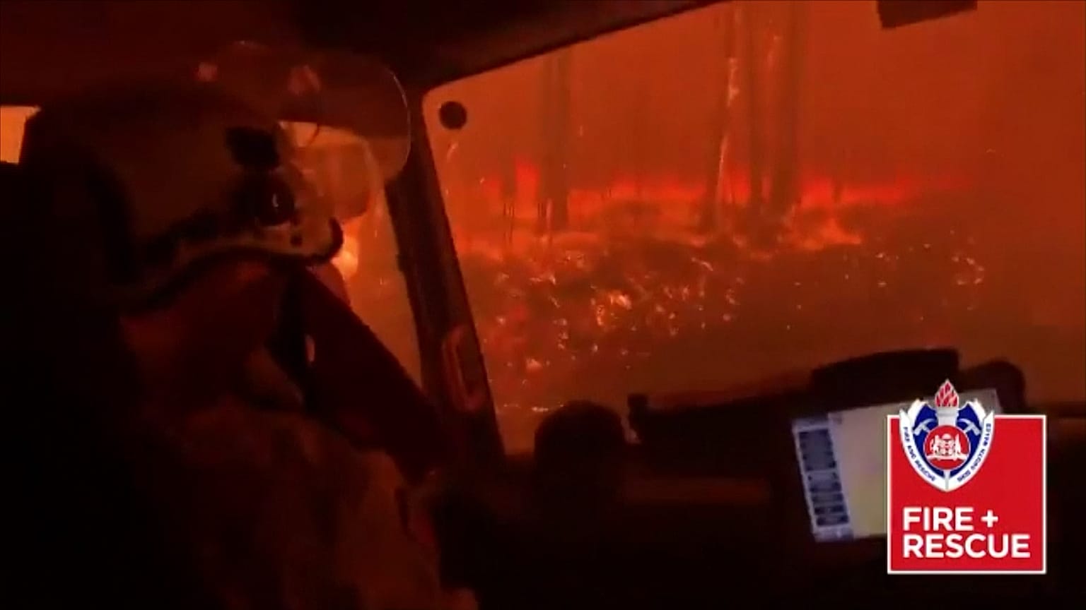 Terrifying moment as Australian firefighters drive through flames