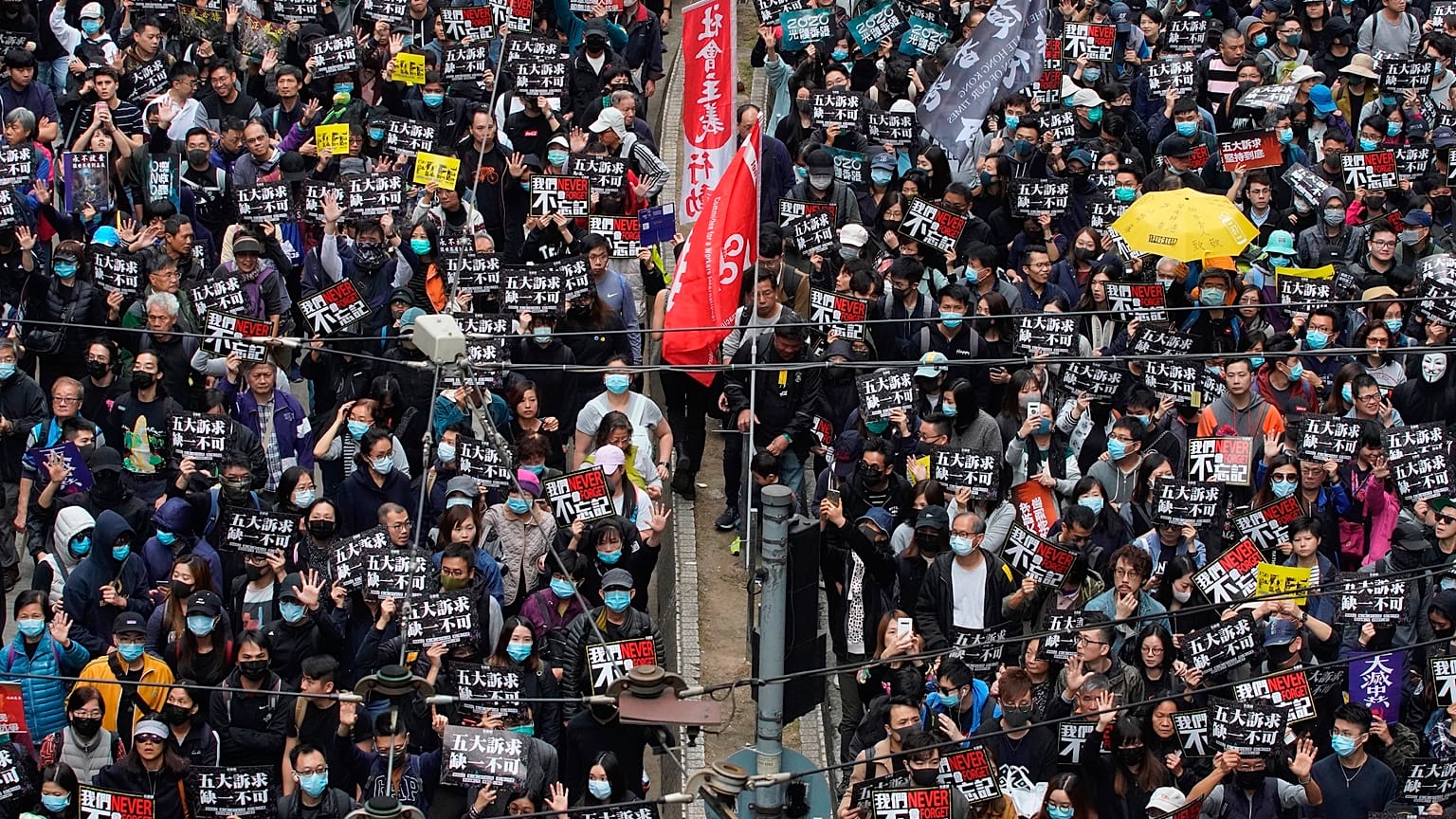 Hong Kong people participate in their annual pro-democracy march to insist their five demands be matched by the government in Hong Kong.