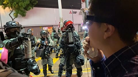 Hong Kong lawmaker gets pepper spray in the face as protests continue