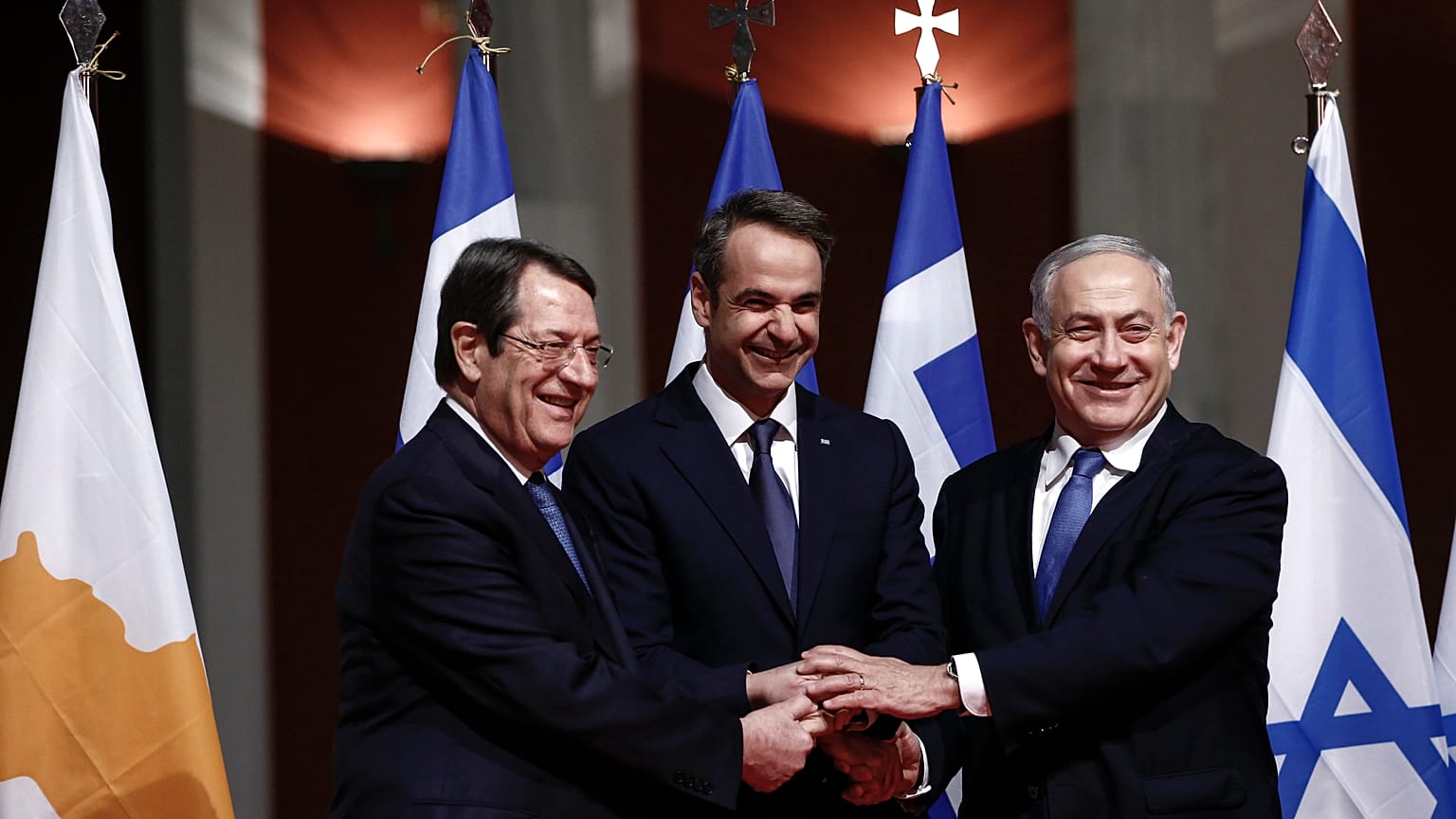 Greece’s Prime Minister Kyriakos Mitsotakis, center, Cypriot President Nicos Anastasiadis left and Israeli Prime Minister Benjamin Netanyahu