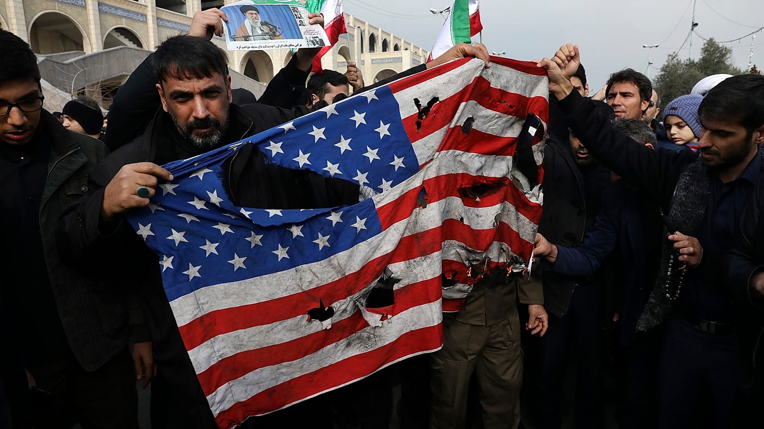 Protesters burn a U.S. flag during a demonstration over the U.S. airstrike in Iraq that killed Iranian Revolutionary Guard Gen. Qassem Soleimani, in Tehran, Iran, Jan. 3, 2020