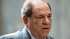 Weinstein charged with rape in LA as separate rape trial starts in New York