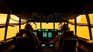 The flight deck of a C-130J Hercules aircraft prepares to land at Merimbula airfield to deploy Fire and Rescue crews.
