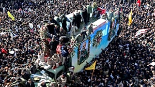 Coffins of Gen. Qassem Soleimani and others who were killed in Iraq by a U.S. drone strike, are carried on a truck during a funeral procession, in the city of Kerman, Iran