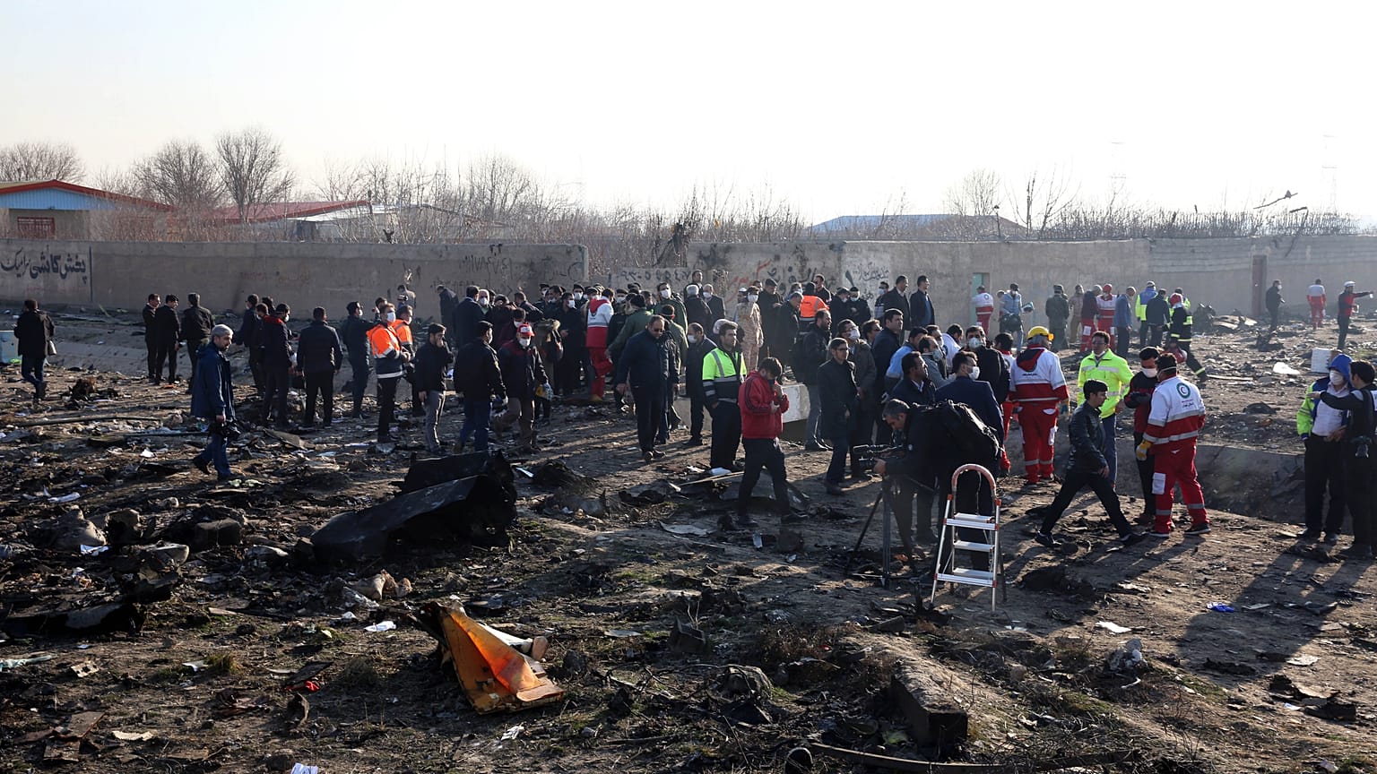 Rescue teams work at the scene after a Ukrainian plane carrying 176 passengers crashed near Imam Khomeini airport in the Iranian capital Tehran on January 8, 2020.