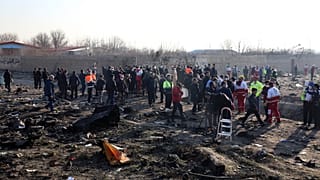 Rescue teams work at the scene after a Ukrainian plane carrying 176 passengers crashed near Imam Khomeini airport in the Iranian capital Tehran on January 8, 2020.