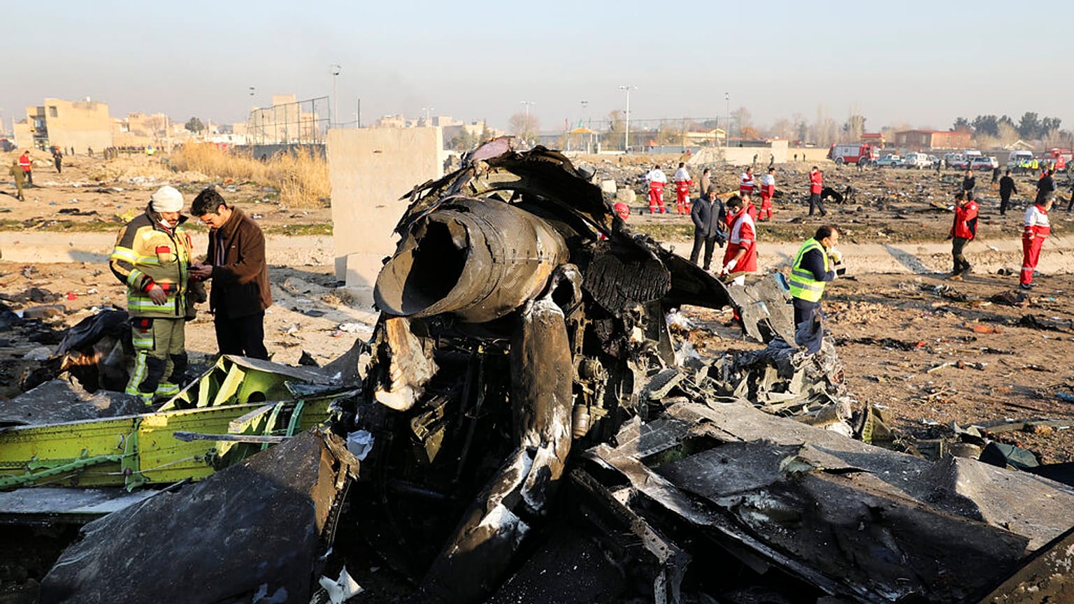 Debris is seen from an Ukrainian plane which crashed as authorities work at the scene in Shahedshahr southwest of the capital Tehran, Iran