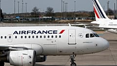 Air France planes are parked on the tarmac at Paris Charles de Gaulle airport, in Roissy, near Paris, Saturday, April 7, 2018.
