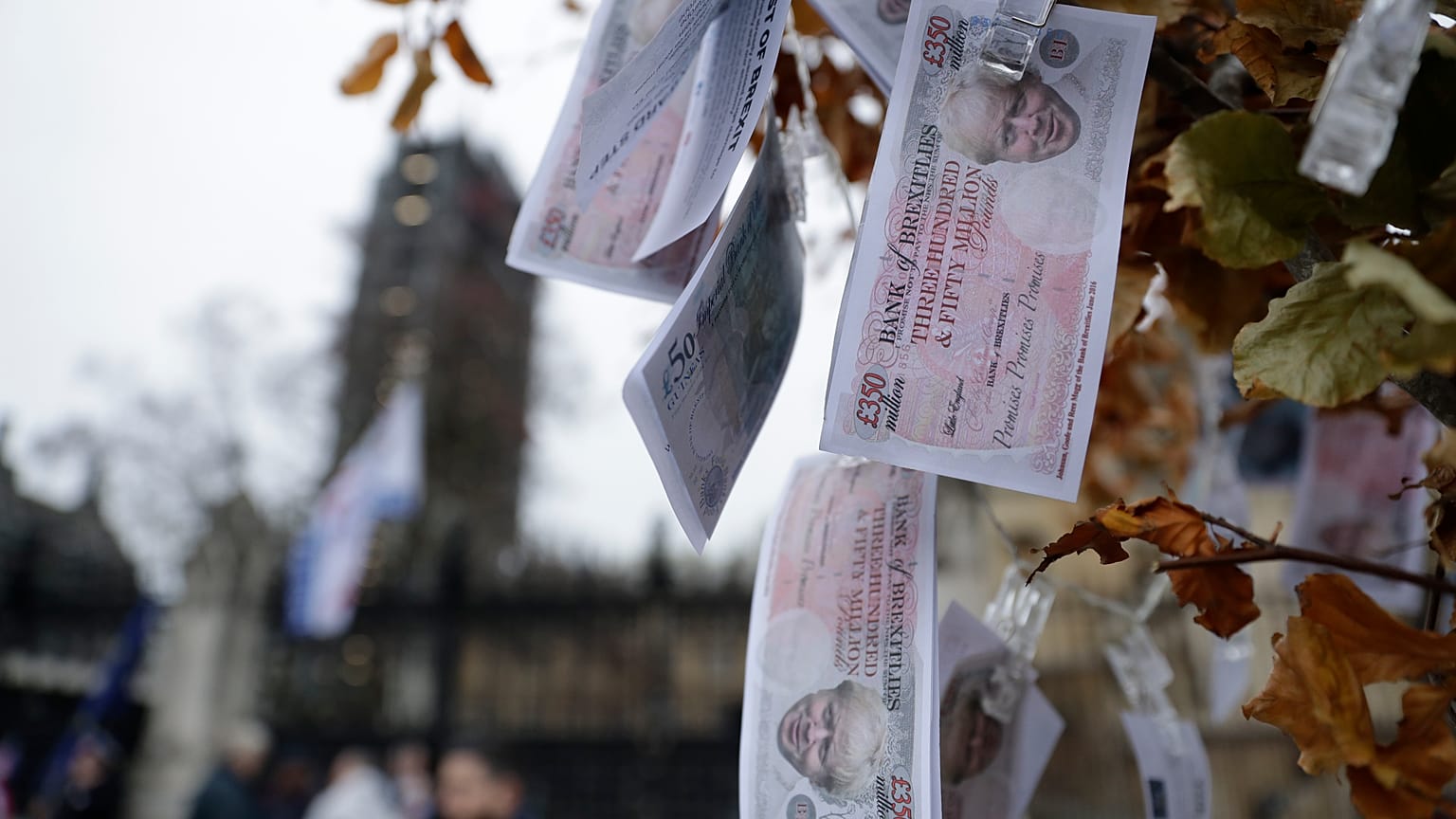 Fake 350 million pound notes bearing the face of British Prime Minister Boris Johnson, hang from a "Magic Money Tree" placed by anti-Brexit protesters