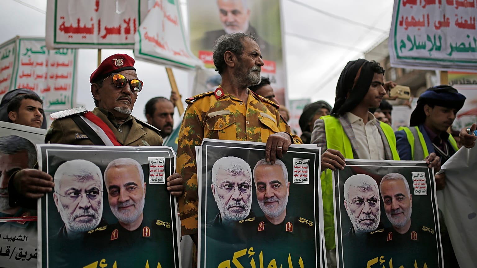 Yemeni Shiite Houthis hold posters of Abu Mahdi al-Muhandis and Qassem Soleimani Sanaa, Yemen, Jan. 6, 2020. (AP Photo/Hani Mohammed