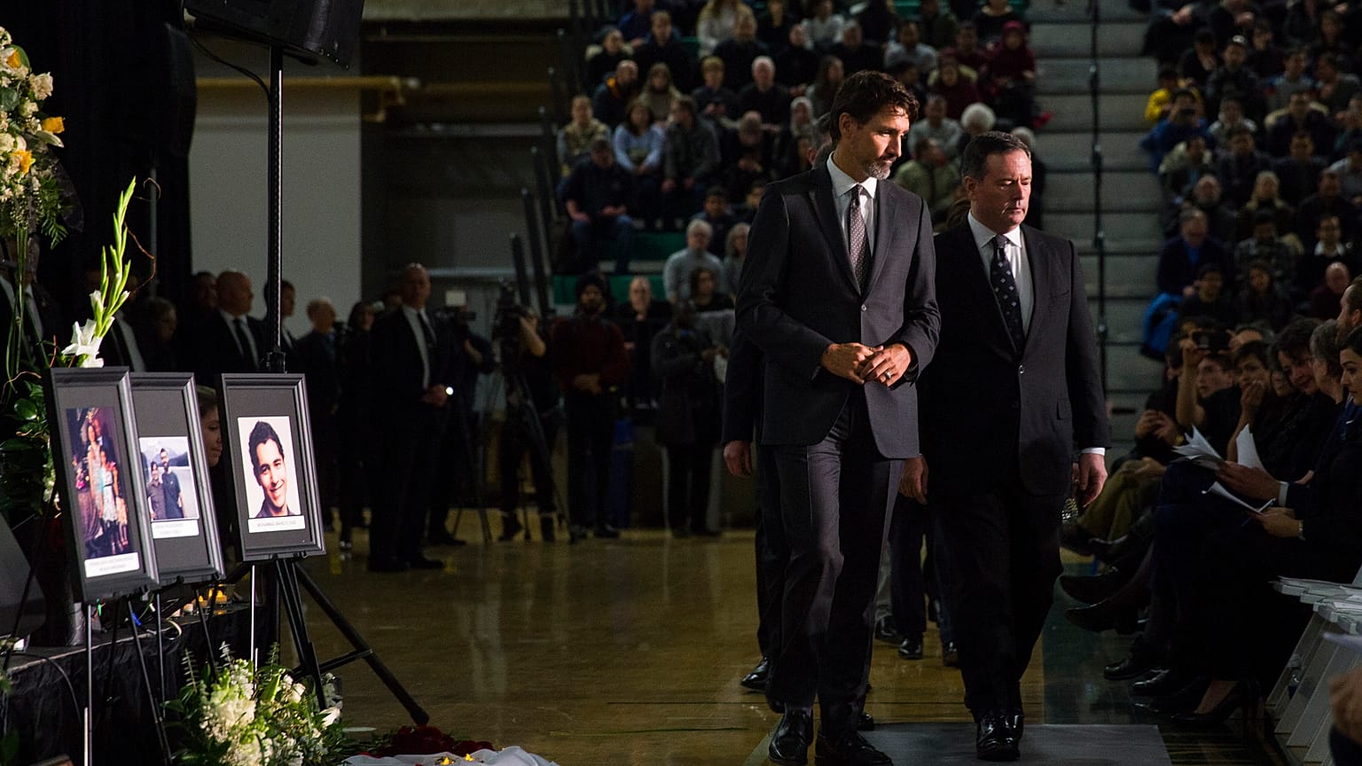 Justin Trudeau, left, arrives with Alberta Premier Jason Kenney during a memorial for the victims of the Ukrainian plane disaster in Iran 
