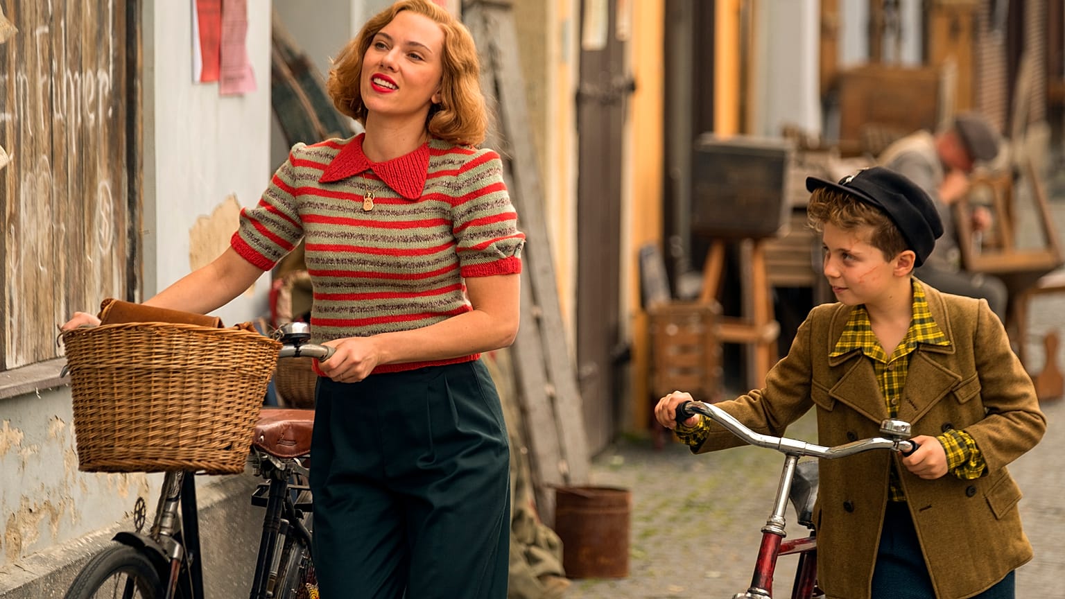 Scarlett Johansson and Roman Griffin Davis in the film JOJO RABBIT.