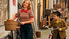 Scarlett Johansson and Roman Griffin Davis in the film JOJO RABBIT.