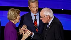Democratic presidential candidate Sen. Elizabeth Warren, D-Mass., and Sen. Bernie Sanders, I-Vt., talk Tuesday, Jan. 14, 2020, after a Democratic presidential primary debate