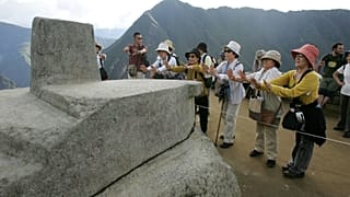 People tour the ruins of Machu Picchu near Cuzco, Peru March 26, 2008 file photo