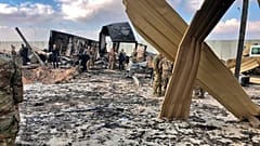 U.S. soldiers and journalists inspect the rubble at a site of Iranian bombing, in Ain al-Asad air base, Anbar, Iraq, Monday, Jan. 13, 2020