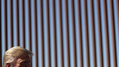 President Donald Trump talks with reporters as he tours a section of the southern border wall, Wednesday, Sept. 18, 2019, in Otay Mesa, California