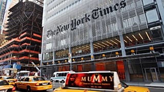 Traffic passes in front of The New York Times building in New York