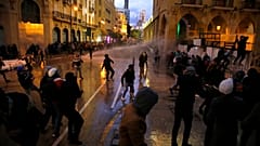 Anti-government protesters clash with the riot police during ongoing protests in Beirut, Lebanon, Wednesday, Jan. 22, 2020.