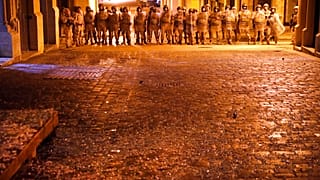 Lebanese army soldiers deploy on a street where anti-government protesters clash with riot police, during a protest against the new government, in downtown Beirut, Lebanon, We