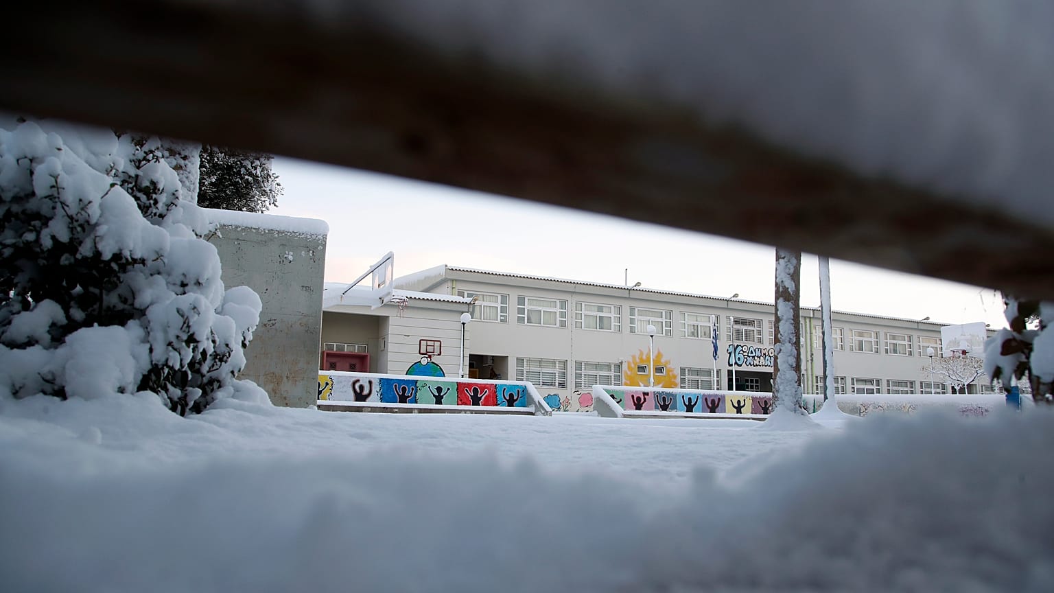 The yard of an elementary school is covered with snow in northern Athens, Tuesday, Jan. 8, 2019