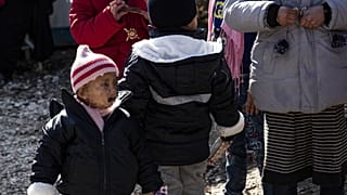 Orphans, from various nationalities including two French (L, 2-L) gather at the Kurdish-run al-Hol camp. January 25, 2020