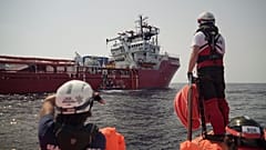 A rescuer waits for orders from the Ocean Viking in the Mediterranean Sea, Tuesday, Sept. 17, 2019. 