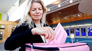 Chris Driller votes in Sacramento, California — one of 14 states taking part in Super Tuesday
