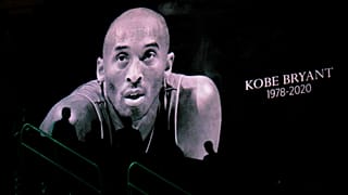 Spectators observe a moment of silence for Kobe Bryant before Opening Night for the NFL Super Bowl 54 football game Monday, Jan. 27, 2020, at Marlins Park in Miami