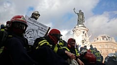 Firefighters gather for a demonstration Tuesday, Jan. 28, 2020 in Paris to demand a better pay and working conditions