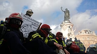 Firefighters gather for a demonstration Tuesday, Jan. 28, 2020 in Paris to demand a better pay and working conditions