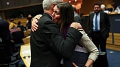 Scottish European Parliament member Aileen McLeod, right, hugs British European Parliament member Richard Corbett.