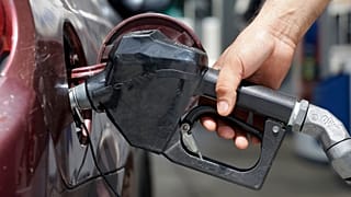 **ATTENTION SHAUN HILL** In this photo taken Tuesday, June 28, 2016, a customer fills his tank, in Miami. (AP Photo/Alan Diaz)