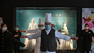 Quarantined hotel workers in Wuhan do exercises to stay active