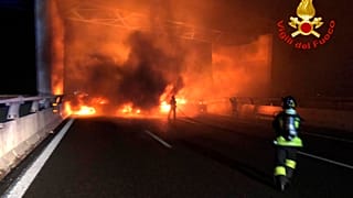 In this photo released by the Italian Firefighters, firemen try to extinguish a dozen vehicles on fire on a highway near Milan, Italy, in the early hours on Jan. 29.