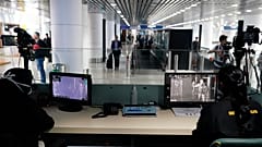 Health officials watch thermographic monitors at a quarantine inspection area at Kuala Lumpur International Airport.