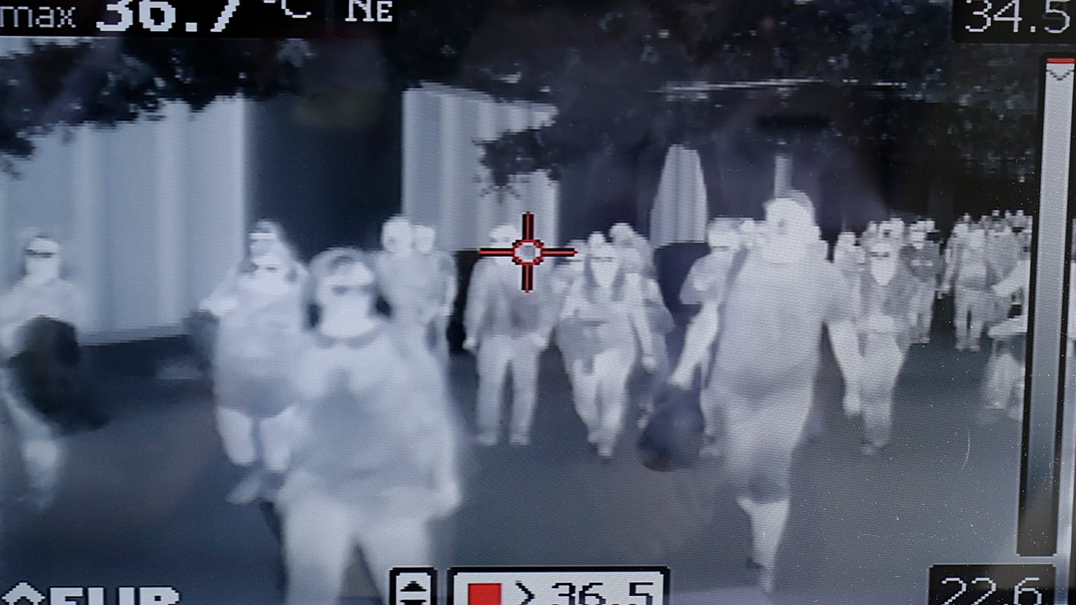 A thermal scanner checks passengers at Manila’s international airport, Philippines on Thursday, Jan. 23, 2020. (AP Photo/Aaron Favila)