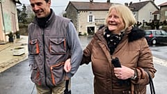 Briton Elaine Bastian walks with her husband, Chris, in the village of Blond, France.
