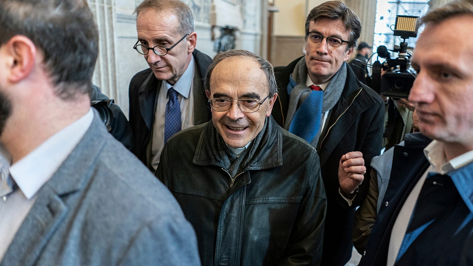 FILE: French Cardinal Philippe Barbarin, center, arrives at the Lyon courtroom for his appeal trial Thursday, Nov.28, 2019 in Lyon, central France. 