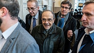 FILE: French Cardinal Philippe Barbarin, center, arrives at the Lyon courtroom for his appeal trial Thursday, Nov.28, 2019 in Lyon, central France. 