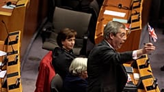 Brexit Party leader Nigel Farage waves the Union flag ahead of a vote on the UK’s withdrawal from the EU  at the European Parliament in Brussels, Wednesday, Jan. 29, 2020.  