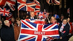 Brexit supporters celebrate during a rally outside Stormont in Belfast, Northern Ireland as Britain left the European Union on Friday, Jan. 31, 2020.