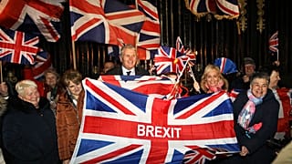 Brexit supporters celebrate during a rally outside Stormont in Belfast, Northern Ireland as Britain left the European Union on Friday, Jan. 31, 2020.